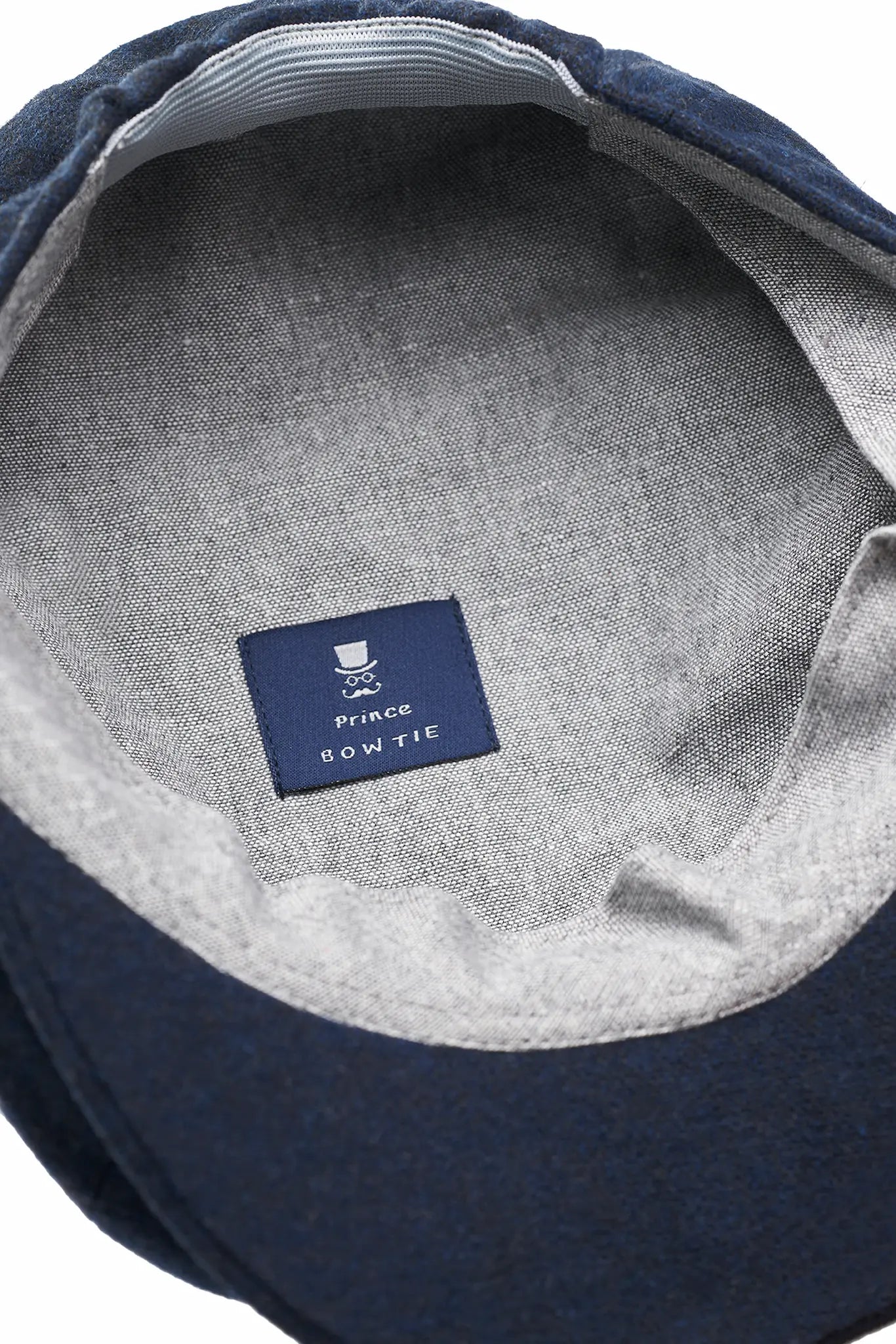(Dunkelblau) Ballonmütze Tweed – Innenseite mit Prince Bowtie Label