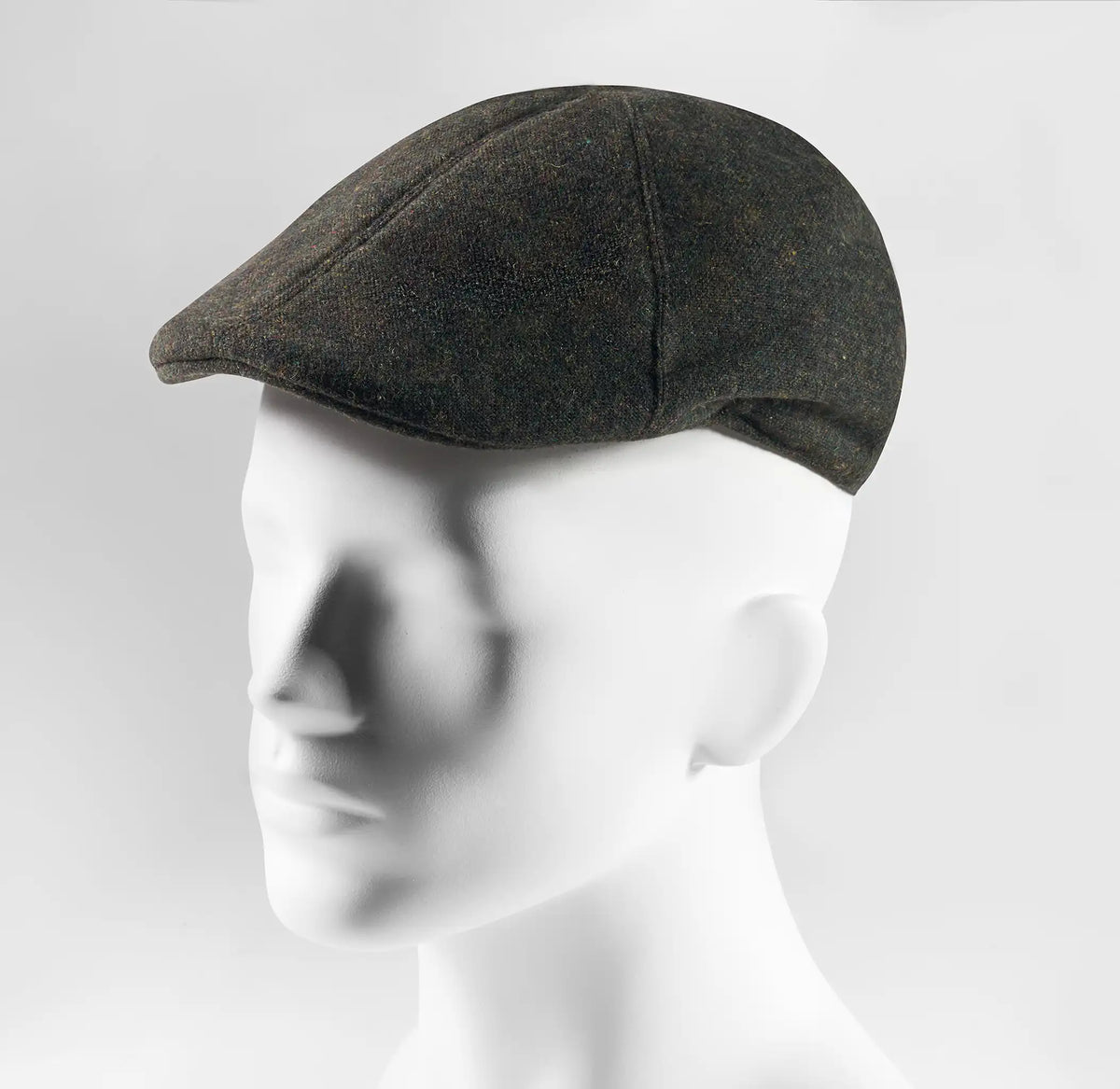 (Dunkelgrün) Schiebermütze Herren Tweed Flat Cap – Seitenansicht auf Mannequin